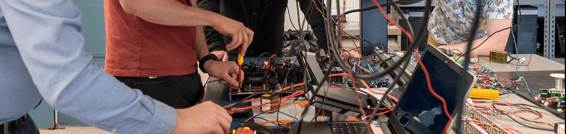 Matthias Preindl and Wesley Pennington working with electrical engineering students